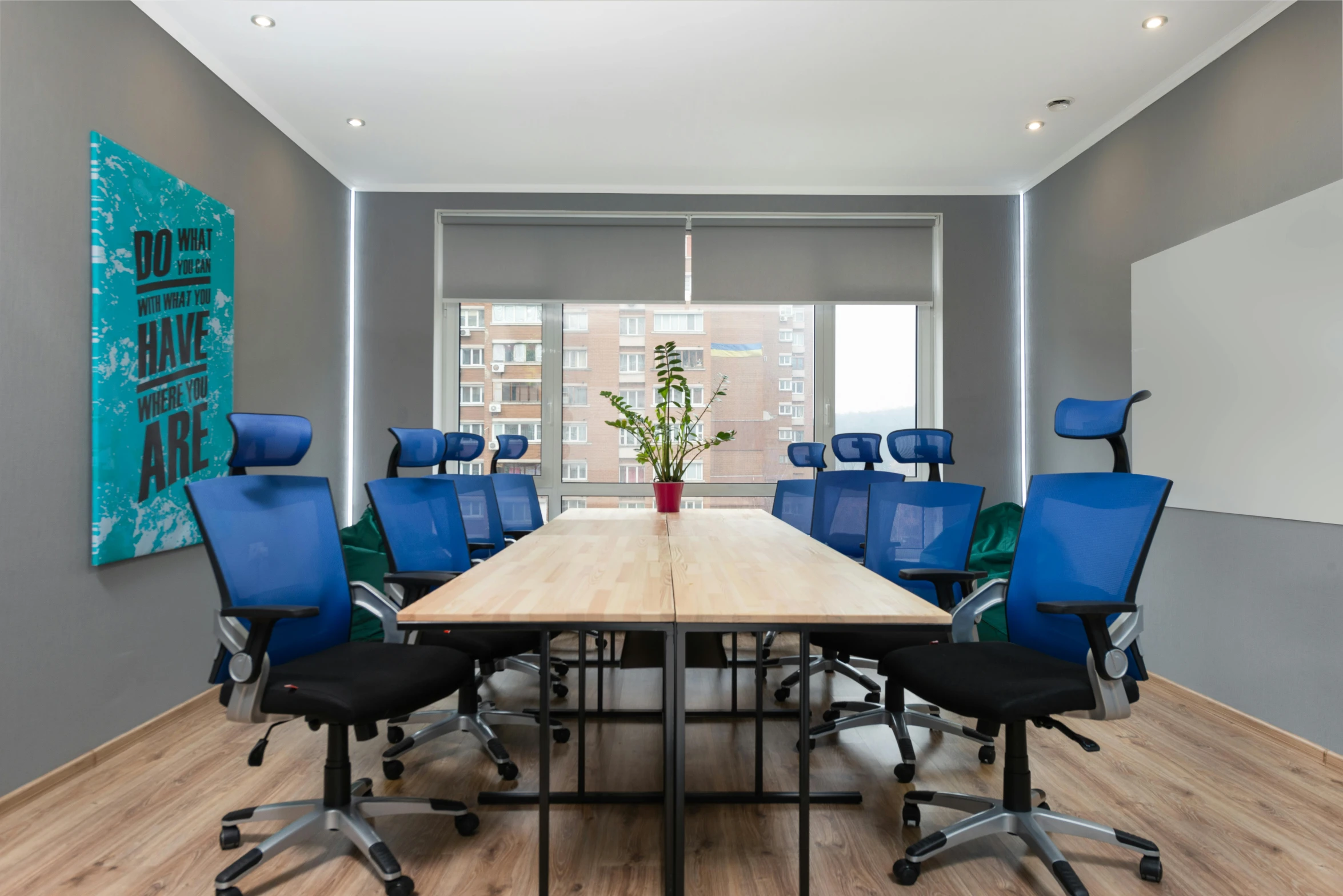 a conference room with blue chairs and a wooden table, by Hirosada II, gutai group, central hub, professional picture, headroom, thumbnail