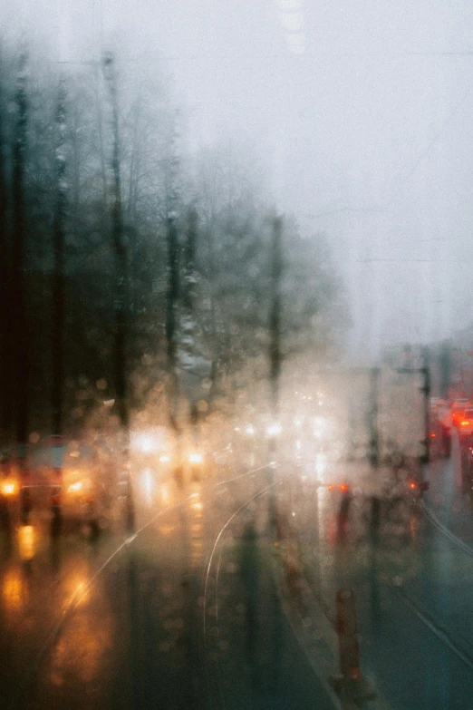 a blurry photo of traffic on a rainy day, inspired by Elsa Bleda, melancholy autumn light, anna nikonova, lit windows, lpoty