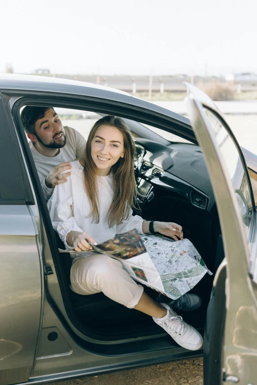 a man and a woman sitting in a car, map, 4l, premium quality, 15081959 21121991 01012000 4k