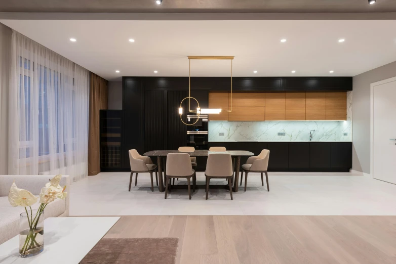 a living room filled with furniture and a dining table, a 3D render, by Andries Stock, pexels contest winner, light and space, luxury bespoke kitchen design, dual tone lighting, gold and black color scheme, minimalistic house in the wood