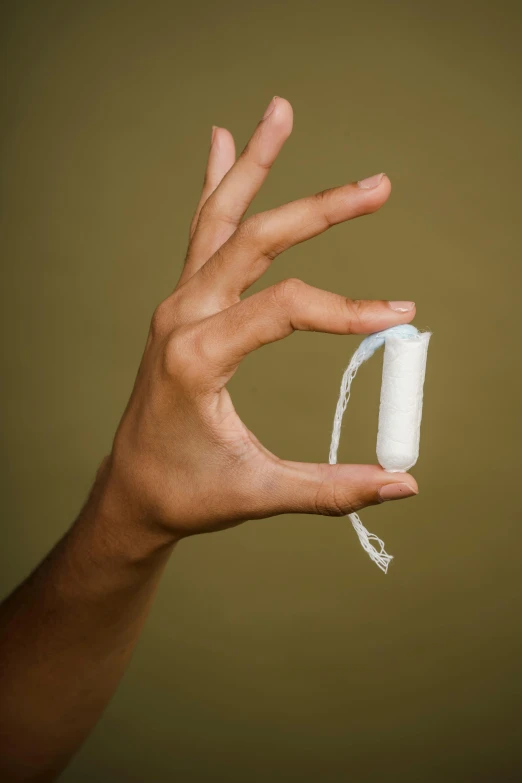 a person holding a video game controller in their hand, an album cover, by Elsa Bleda, offering the viewer a pill, holding a white flag, medium close - up, pod