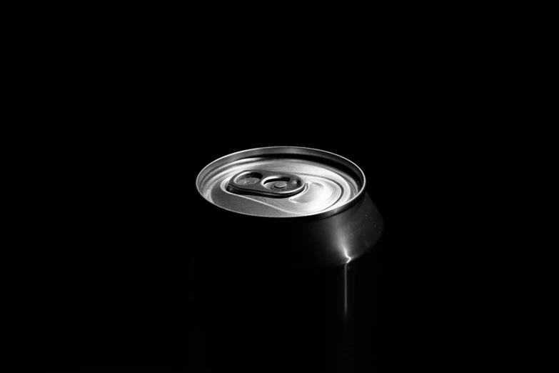 a black and white photo of a soda can, by Mathias Kollros, pexels, conceptual art, vantablack chiaroscuro, made of drink, smooth shiny metal, minimalist design