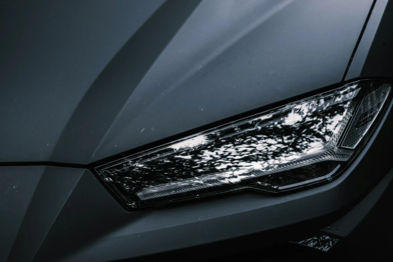 a close up of the headlights of a car, by Adam Marczyński, pexels contest winner, photorealism, vantablack chiaroscuro, grey metal body, instagram picture, rectangle