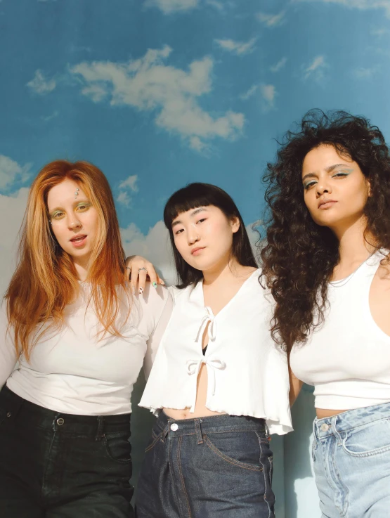 a group of women standing next to each other, an album cover, inspired by Ren Hang, unsplash, renaissance, wild ginger hair, wearing a light shirt, mixed race, albino white pale skin