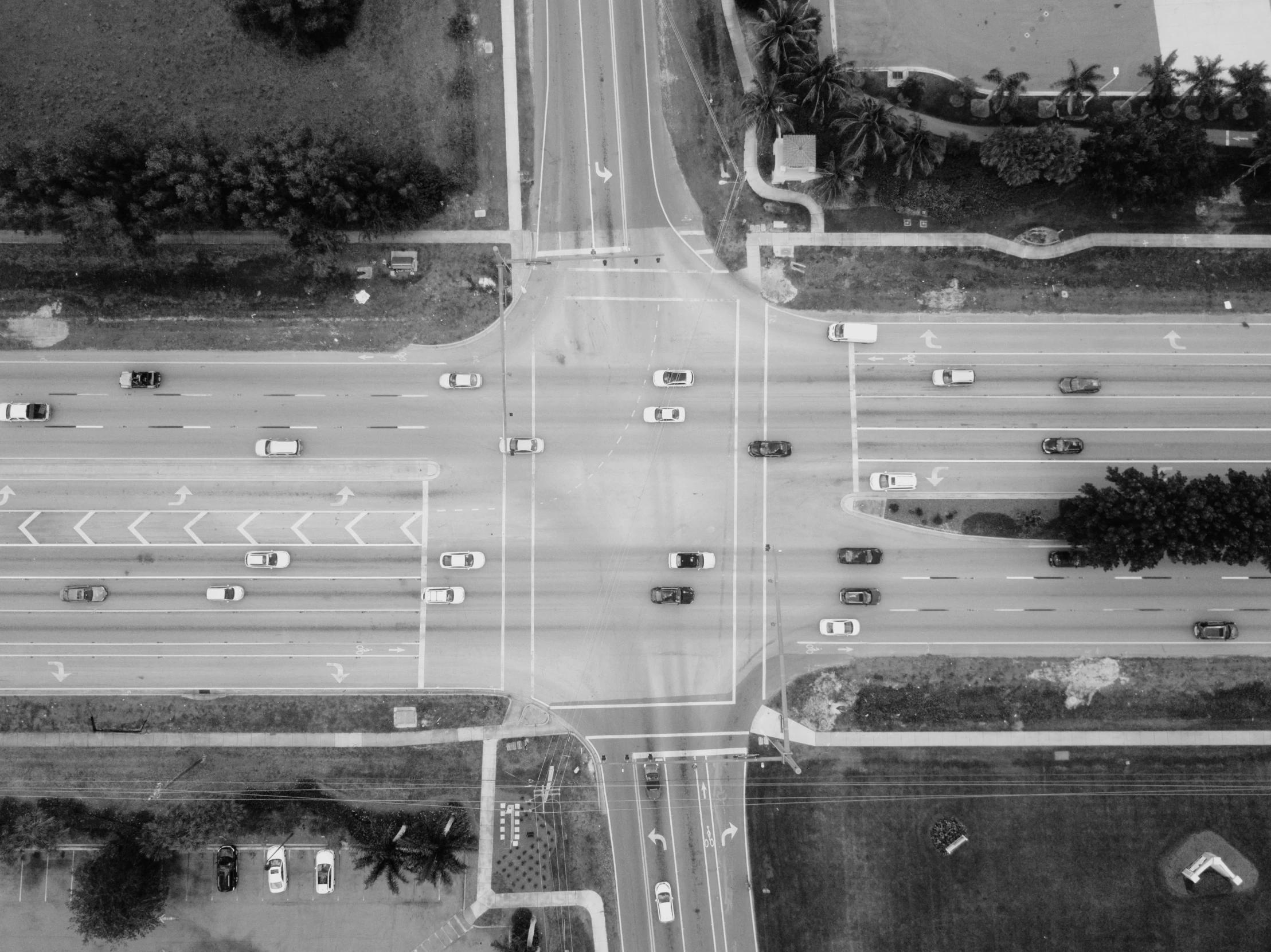 a black and white photo of an intersection, pexels, florida, aerial illustration, square, traffic accident