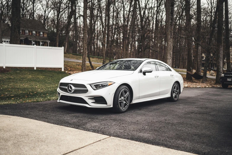 a white car parked on the side of the road, by Drew Tucker, pexels contest winner, renaissance, mercedez benz, 💋 💄 👠 👗, at home, glossy white armor