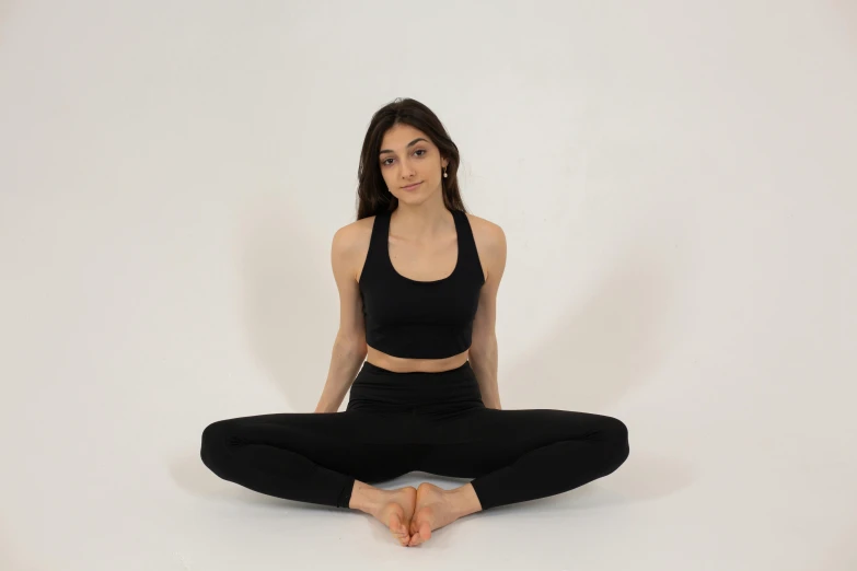 a woman sitting in the middle of a yoga pose, by Nina Hamnett, black leggings, front on, highly upvoted, seamless