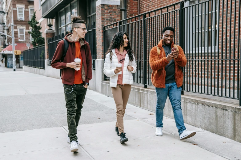 a group of people walking down a sidewalk, trending on pexels, brown clothes, young adult, background image, high school