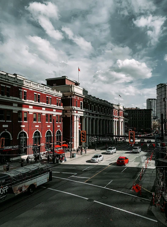 a large red brick building sitting on the side of a road, inspired by Thomas Struth, pexels contest winner, vancouver school, train station in summer, japanese downtown, today\'s featured photograph 4k, musee d'orsay 8 k