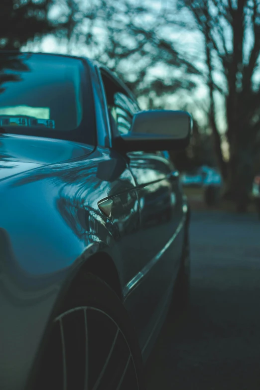 a car parked on the side of the road, pexels contest winner, photorealism, blue gray, profile picture, side light, zoomed in shots