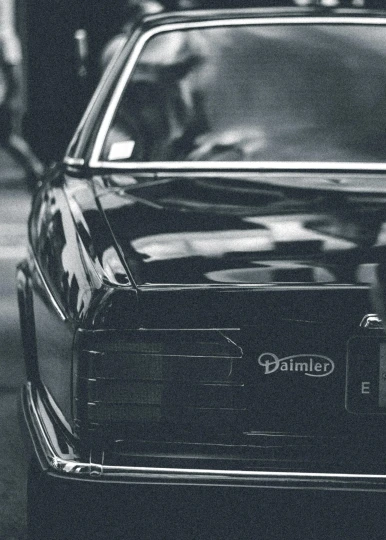 a black and white photo of a car, an album cover, by David Palumbo, pexels contest winner, panther, demna gvasalia, 1980 cars, graphic detail