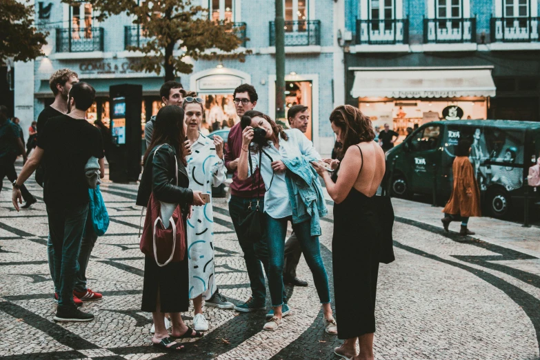 a group of people standing next to each other on a street, pexels contest winner, happening, portugal, square, promotional image, afternoon hangout