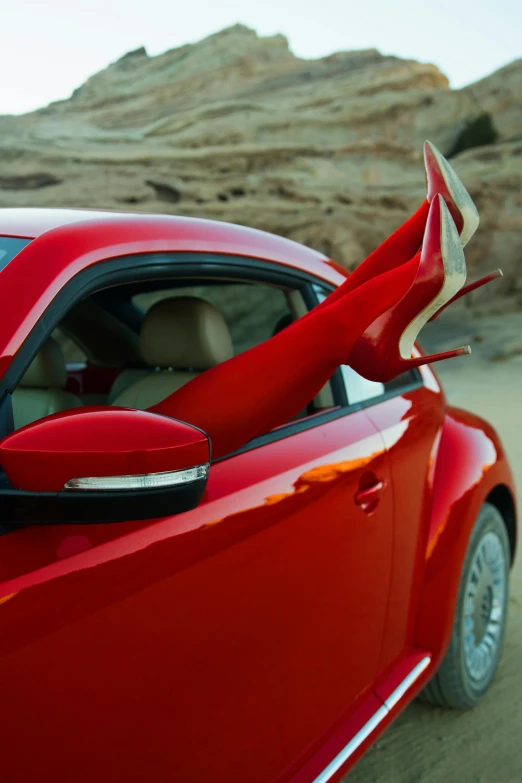 a red car with a surfboard sticking out of the window, sharp metal dragon claws, slide show