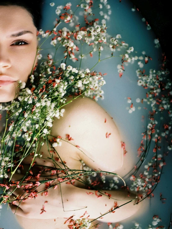 a woman holding a bunch of flowers in her hands, an album cover, inspired by Elsa Bleda, art photography, dewy skin, ignant, gypsophila, organic seductive geisha