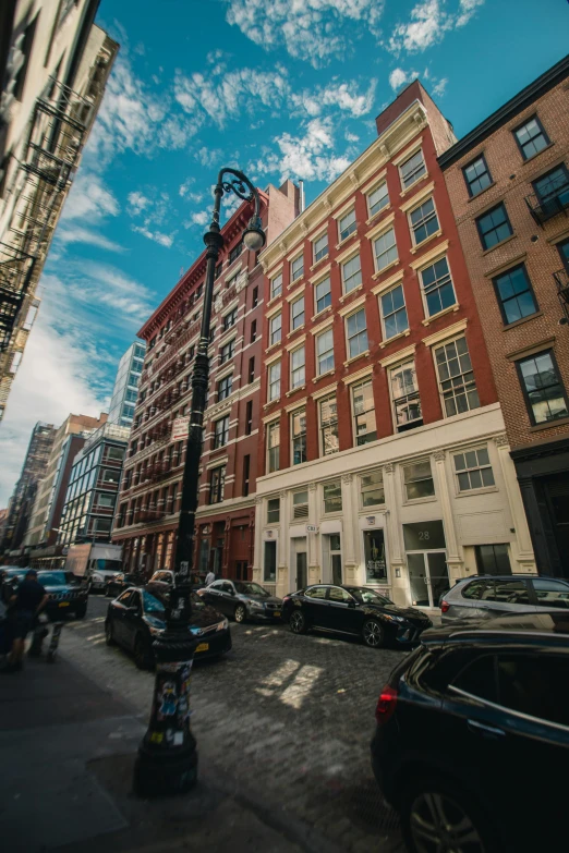 a city street filled with lots of tall buildings, new york alleyway, slide show, red building, white buildings