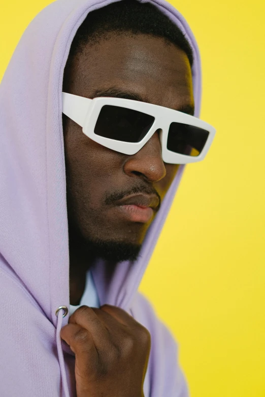 a man wearing sunglasses and a hoodie, inspired by Terrell James, trending on pexels, visual art, square rimmed glasses, pastel clothing, wearing white clothes, kano)