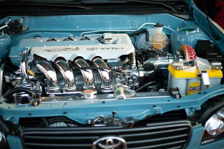 a close up of the engine of a car, by Carey Morris, pexels contest winner, inside of a tokyo garage, performance, cardboard, 1 5 9 5