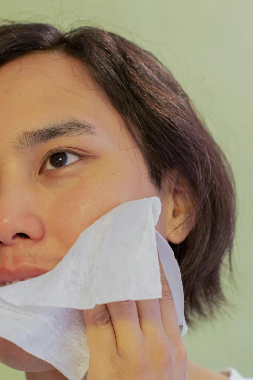 a woman brushing her teeth with a tissue, an album cover, trending on pexels, happening, asian male, closeup of sweating forehead, silicone skin, detailed face face face face