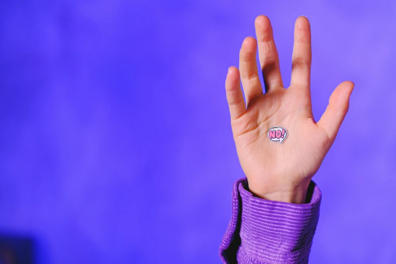 a close up of a person's hand with a ring on it, inspired by L. A. Ring, holography, purple background, holding a milkor mgl, badge, hand gesture