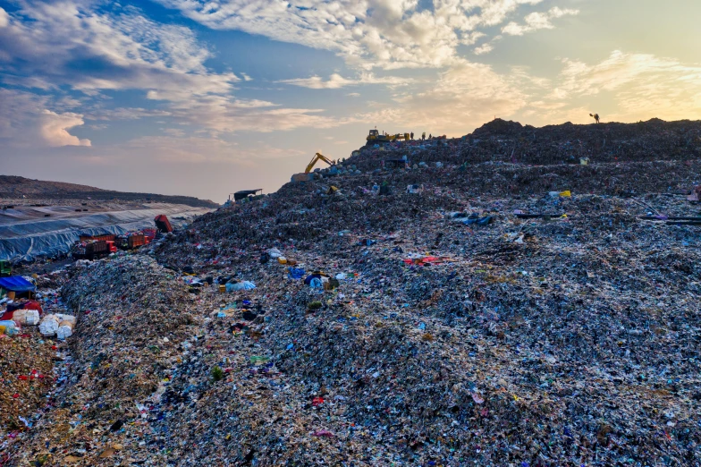 a group of people standing on top of a pile of trash, by Daniel Lieske, unsplash, plasticien, panorama, avatar image, mining, qiangshu