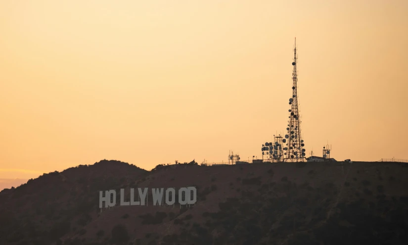 a view of the hollywood sign from the top of a hill, pexels contest winner, art nouveau, in a sunset haze, brown, a wooden, cast