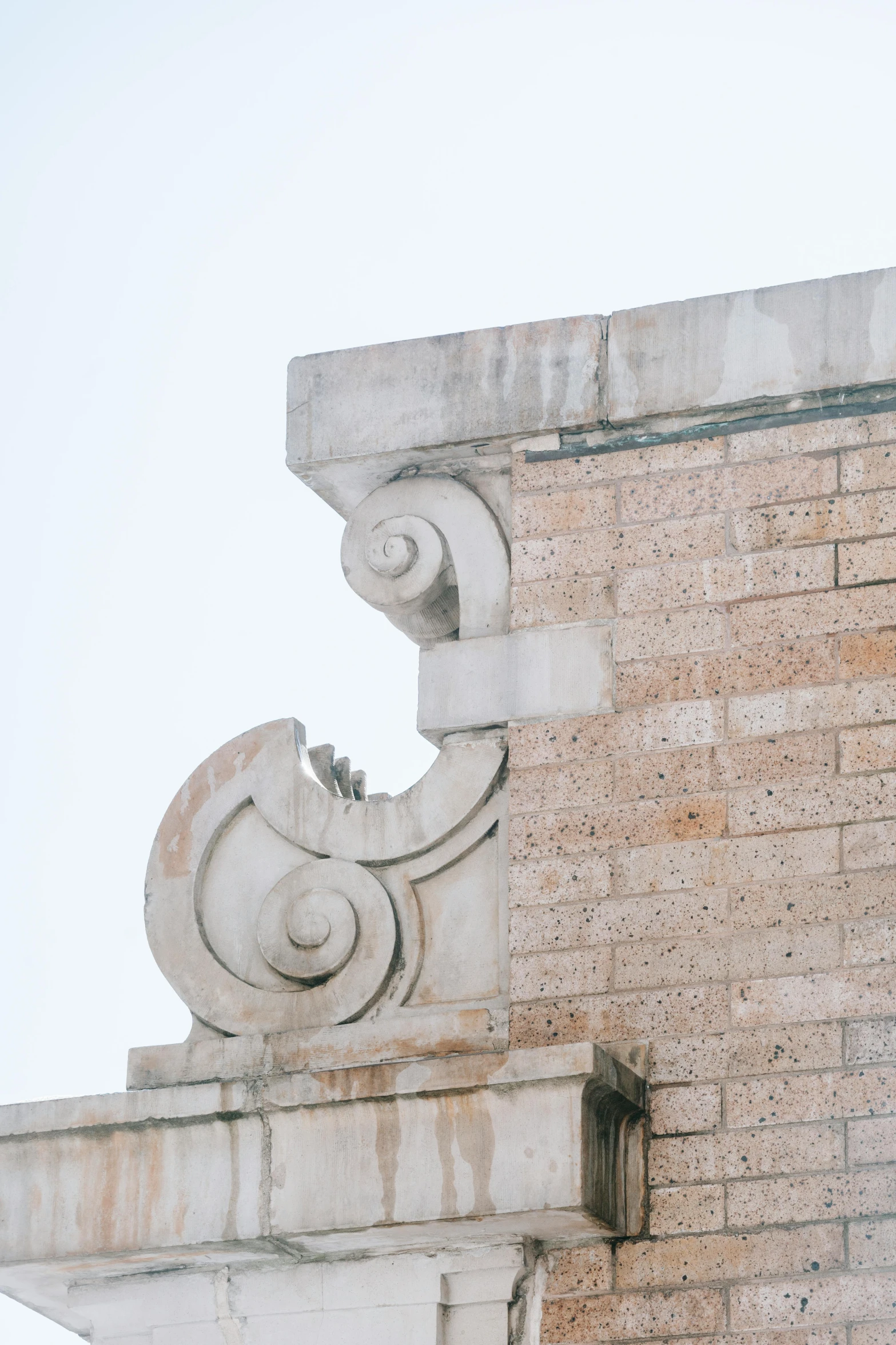 a clock that is on the side of a building, an art deco sculpture, trending on unsplash, berlin secession, deep crevices of stone, close - up profile, very sparse detail, acanthus scrolls