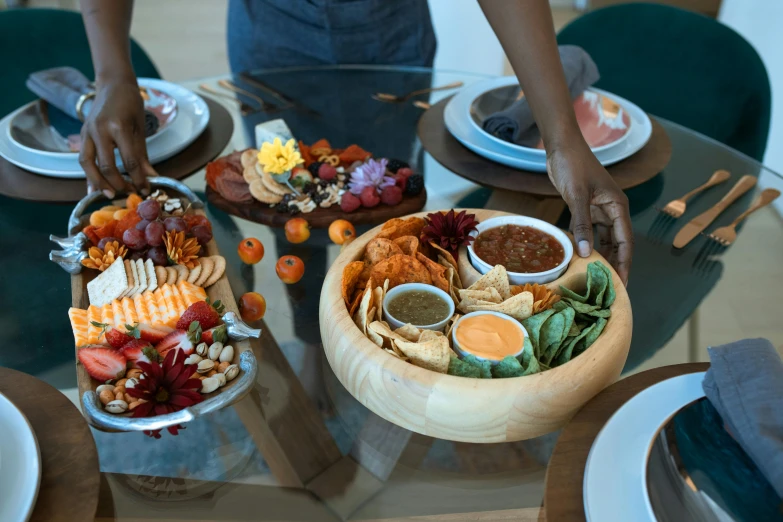 a glass table topped with plates of food, by Carey Morris, pexels contest winner, carrying a tray, ayahausca, ouchh and and innate studio, serving body