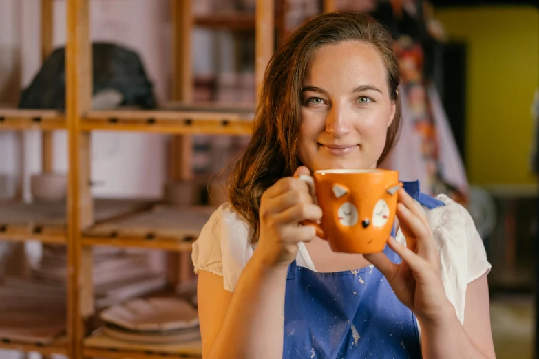 a close up of a person holding a cup, a portrait, she is in the potions workshop, aussie baristas, white mug, thumbnail