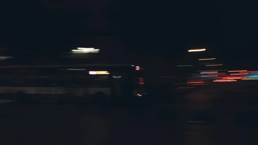 a blurry picture of a bus at night, unsplash, car chase, spooky photo, soft light.4k, quick witted