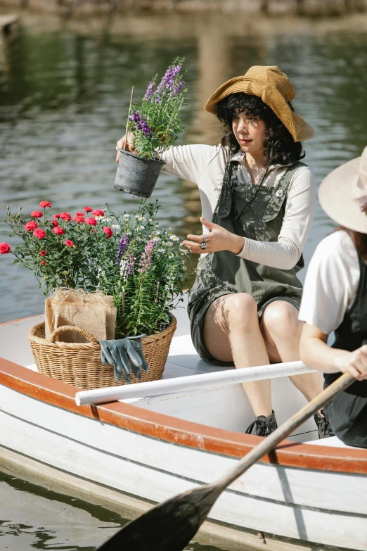 a couple of people that are in a boat, inspired by Konstantin Somov, unsplash, renaissance, cottagecore flower garden, wearing a straw hat and overalls, production photo, yuuka kazami