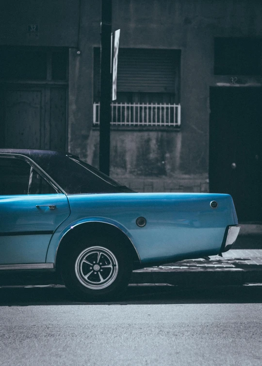 a blue car parked on the side of the road, inspired by Elsa Bleda, pexels contest winner, palermo city street, soft top, 1982, glass and metal : : peugot onyx