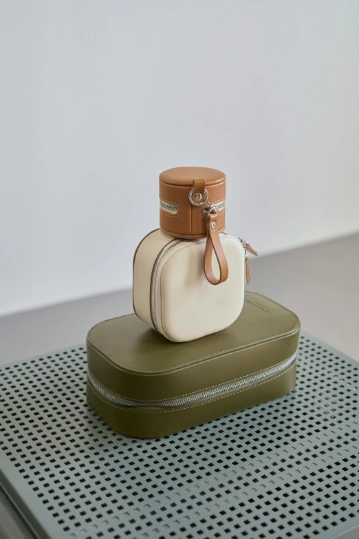 a couple of suitcases sitting on top of a table, round bottle, designer product, muted colors. ue 5, soap