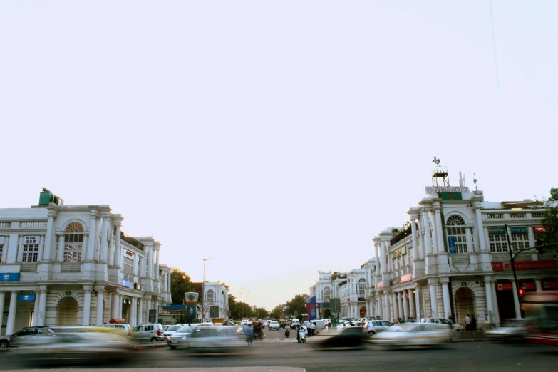 a street filled with lots of traffic next to tall buildings, unsplash, hyperrealism, samarkand, khedival opera house, 000 — википедия, square