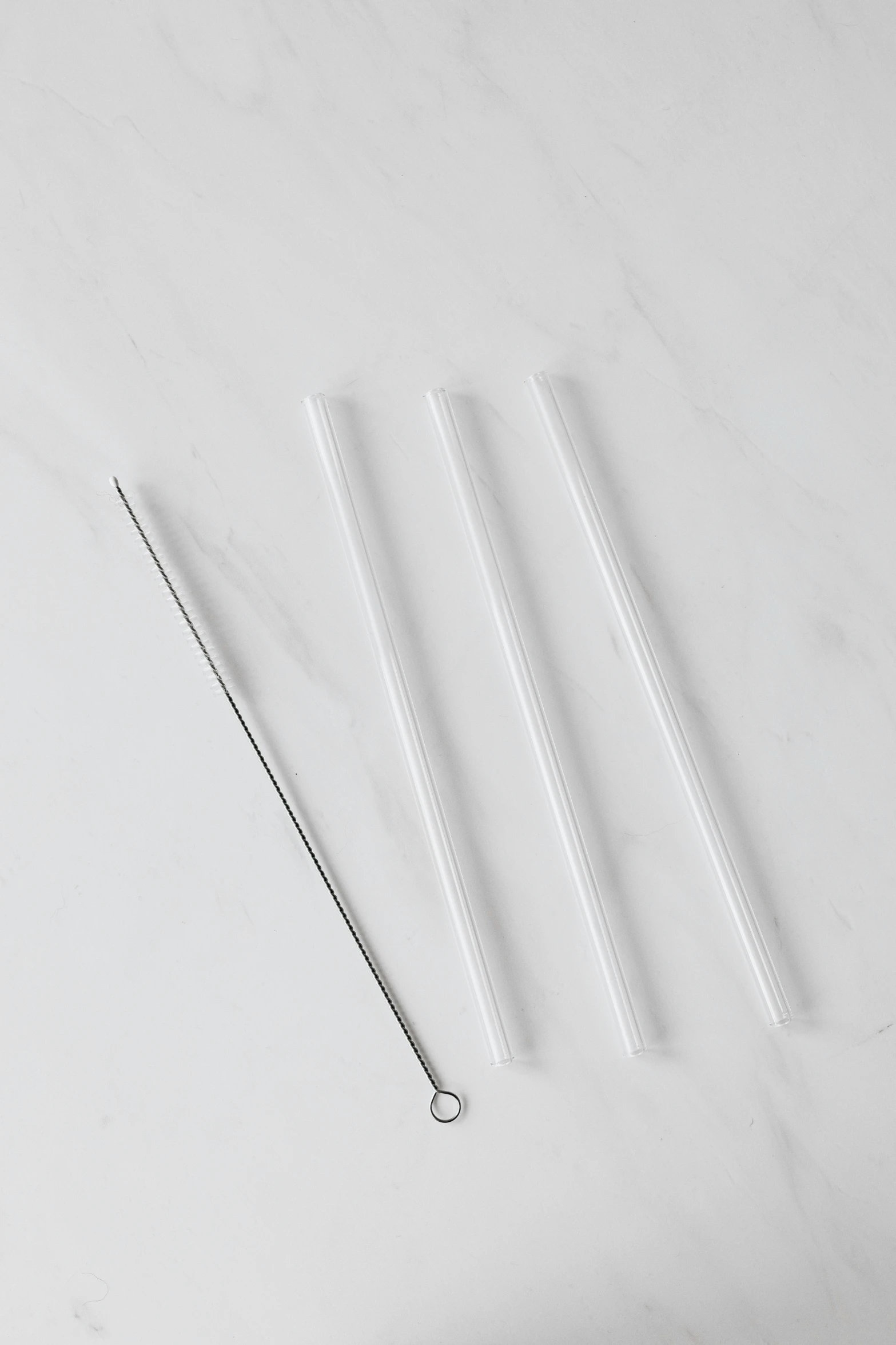 a bunch of needles sitting on top of a table, glassware, 3 - piece, 2 1 0 mm, white plastic