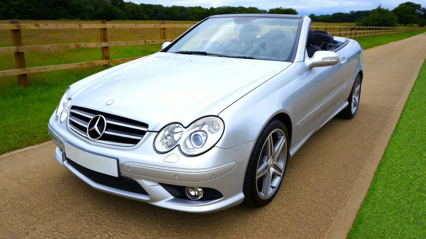 a silver mercedes benz benz benz benz benz benz benz benz benz benz benz benz benz benz benz, pixabay contest winner, convertible, taken in the 2000s, with sleek lines and a powerful, shiny skin”