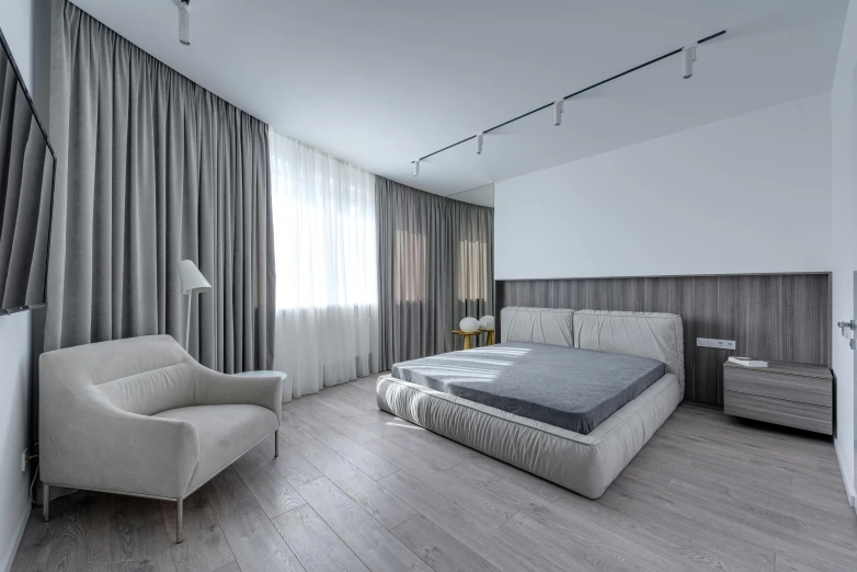 a bed room with a neatly made bed and a chair, inspired by Pavel Fedotov, smooth solid concrete, wooden parquet, fully covered in drapes, high-quality photo