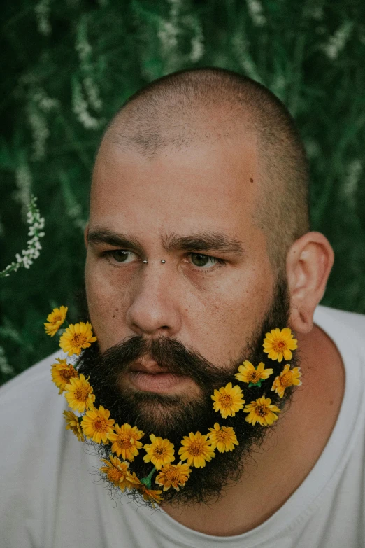 a man with a beard and flowers in his hair, an album cover, inspired by Paul Henry, unsplash, buzz cut, rex orange county, yellow flowers, bigger chin