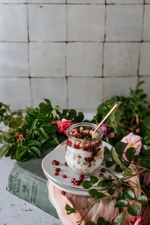 a close up of a plate of food on a table, a still life, inspired by Henriette Grindat, trending on pexels, yogurt, dreamscape in a jar, maroon, decorated with flowers