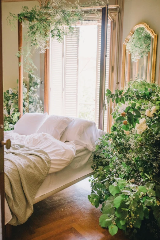 a bed sitting in a bedroom next to a window, inspired by Elsa Bleda, trending on unsplash, overgrown with lush plants, flowering vines, full body in frame, on a planet of lush foliage