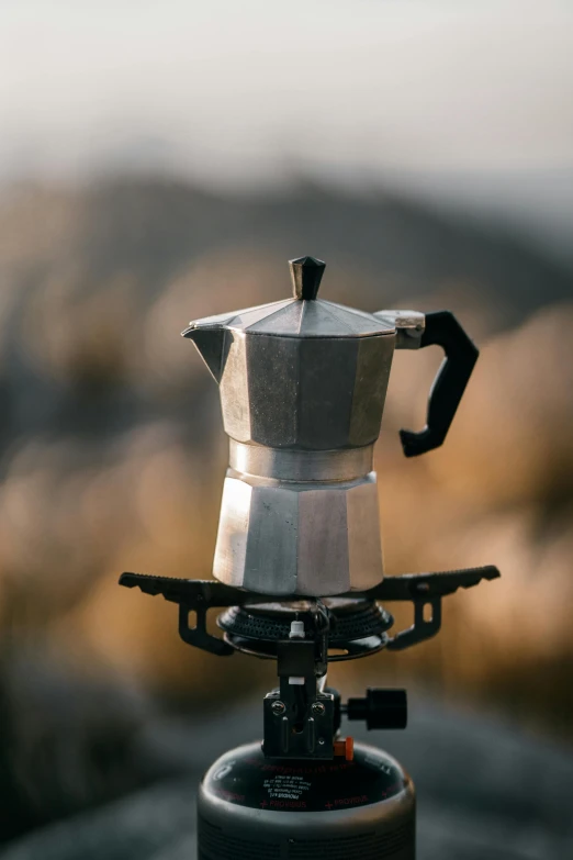 a coffee pot sitting on top of a stove, pexels contest winner, al fresco, paul barson, tripod, tabletop model