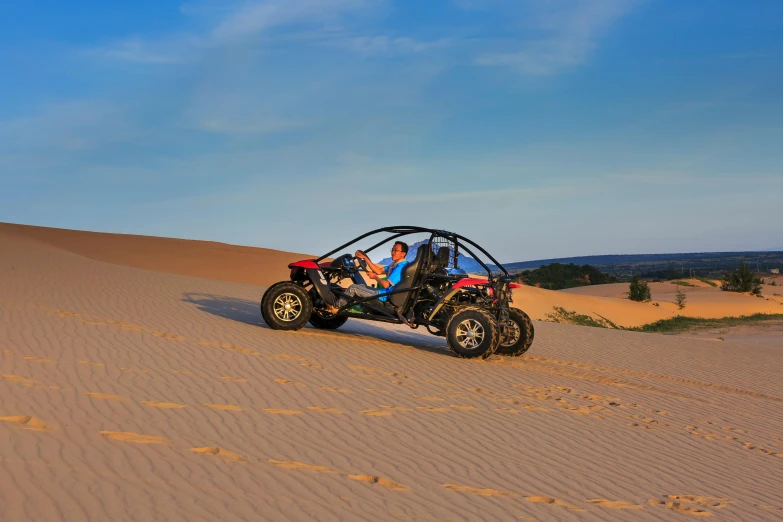 a couple of people riding on the back of a buggy, victorian arcs of sand, soft top, jodorwoski's dune, avatar image