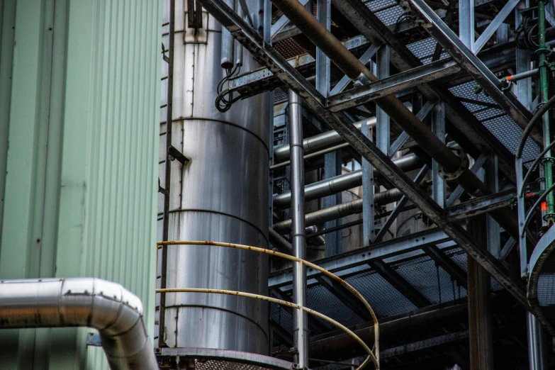 a bunch of pipes that are next to a building, a portrait, unsplash, chemical plant, a green, profile image, brown