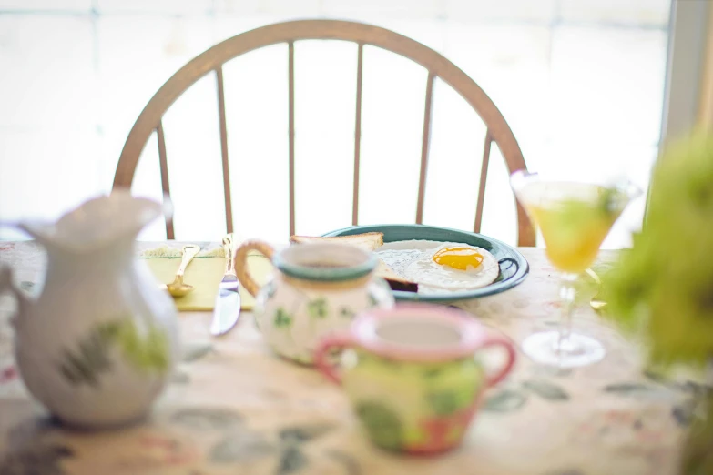 a close up of a plate of food on a table, a still life, flickr, happening, green tea, turquoise pink and yellow, sun puddle, table set for second breakfast