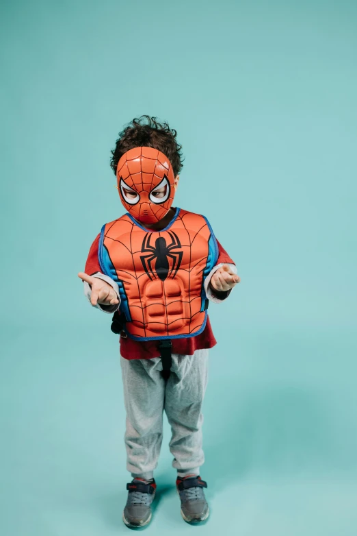 a young boy wearing a spider - man costume, by Nina Hamnett, pexels, pop art, future inflatable jacket, facing the camera, blippi, body armour