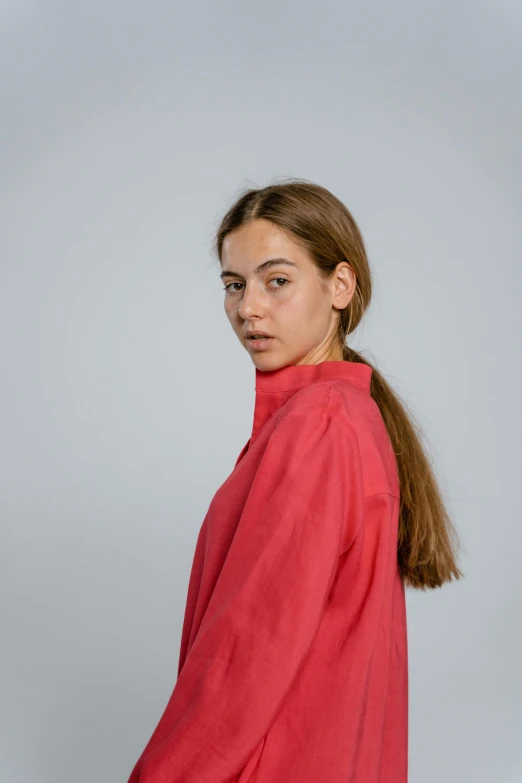 a woman wearing a red shirt and black pants, by Tobias Stimmer, pexels contest winner, hyperrealism, headshot profile picture, long shirt, young teen, some pink