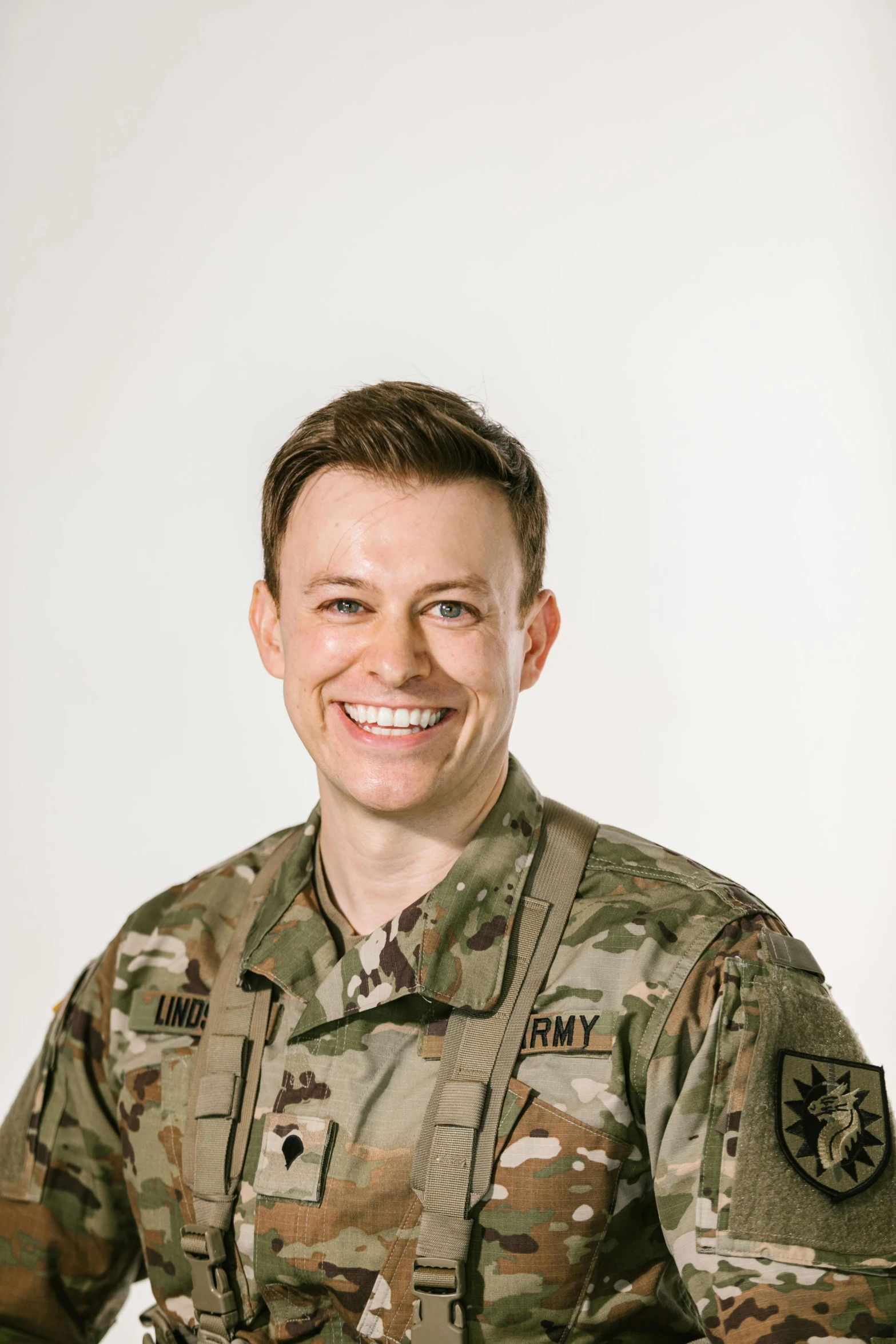 a man in a military uniform posing for a picture, a portrait, by Kristin Nelson, reddit, plain background, vp of marketing, emily rajtkowski, on clear background