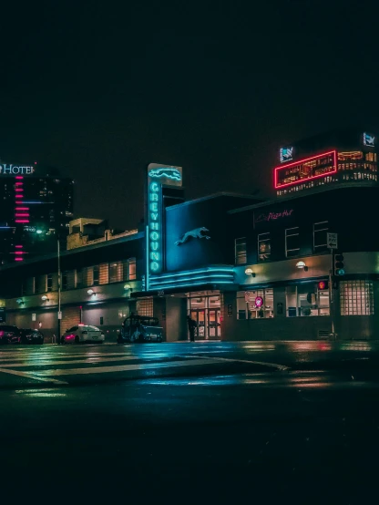 a city street filled with traffic at night, a colorized photo, by Ryan Pancoast, unsplash contest winner, hypermodernism, restaurant exterior photography, drive in movie theater, retro architecture, cinematic. art deco