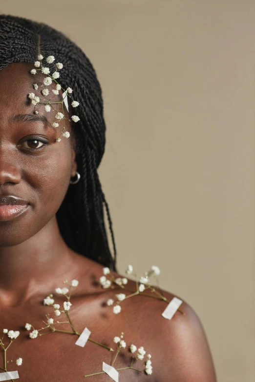 a woman with a lot of pins on her chest, inspired by Ras Akyem, trending on pexels, afrofuturism, white and gold dress, beautiful natural skin, black teenage girl, pearls