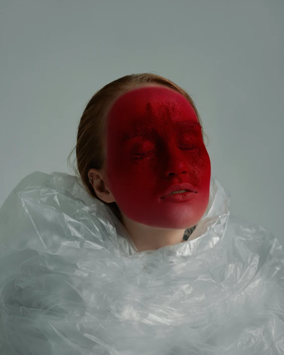 a woman with a red face covered in plastic, an album cover, inspired by Ignacy Witkiewicz, hyperrealism, skincare, a cold, ignant, white and red body armor