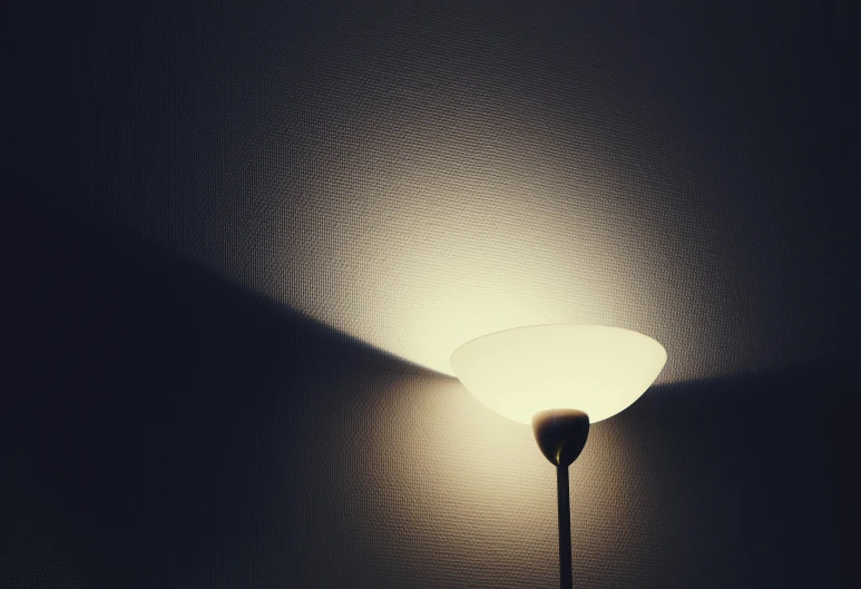 a close up of a light on a wall, pexels contest winner, beige and dark atmosphere, lamp ( ( ( armchair ) ) ) ), low ceiling, volumetric lighting - h 7 6 8